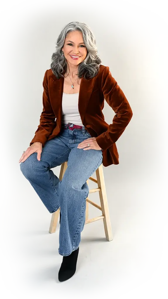Dalisia in red jacket sitting on stool